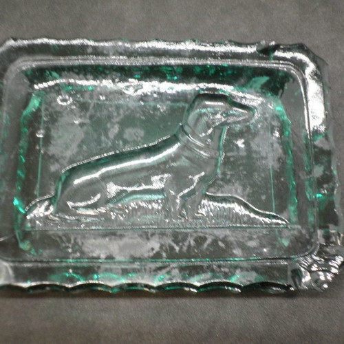 Antique ashtrays pair used with embossed dogs in dark green glass