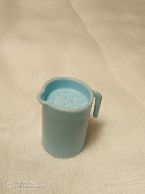 Large miniature pitcher with ice cubes plastic