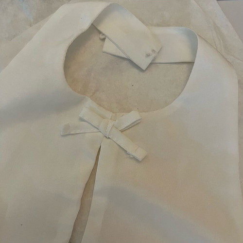 White sleeveless top with bows size S like new