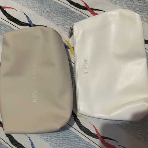 Toiletry bags Kevin Murphy and Kérastase used, white and beige
