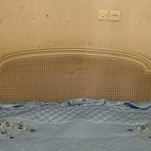 Vintage wooden double bed with wicker headboard, like new, includes slats and mattress