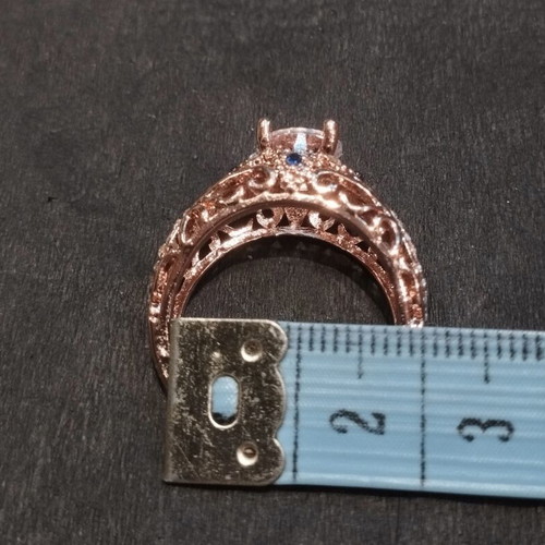 Elegance rose gold ring with white and blue stones