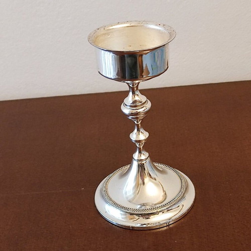 Small candlestick like new with glossy metal finish 14cm height