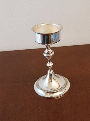 Small candlestick like new with glossy metal finish 14cm height