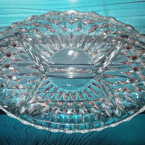 Oval glass platter for nuts used with small chip