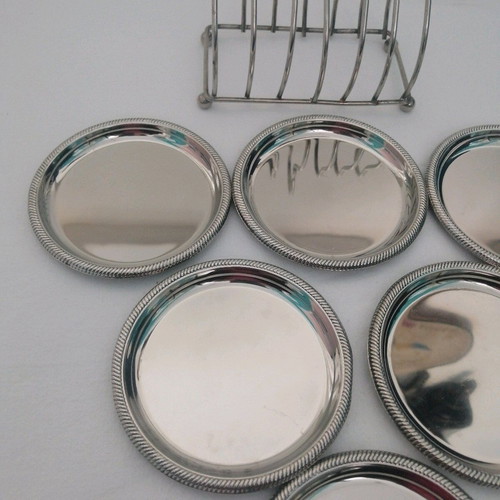Vintage silver coaster set with elegant stand, like new