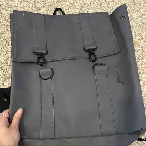 Rains backpack men's used with front wear, gray