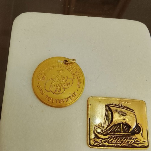 Vintage advertising keychain Pinocchio and metal trireme badge used