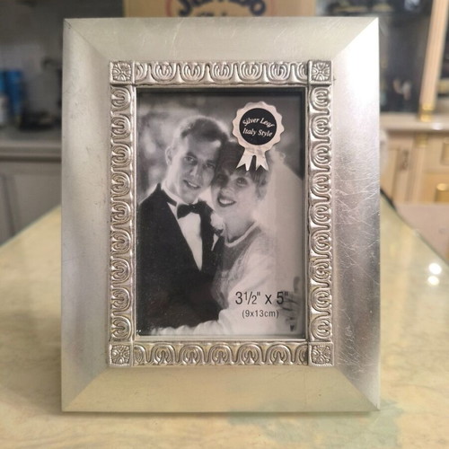 Silver photo frame like new with elegant decorative border