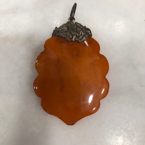 Amber pendant used, orange color