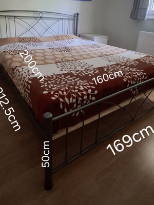 Double bed with metal frame and orthopedic mattress