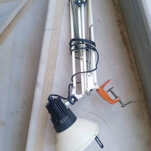 Office lamp with articulated spring and spiral clock