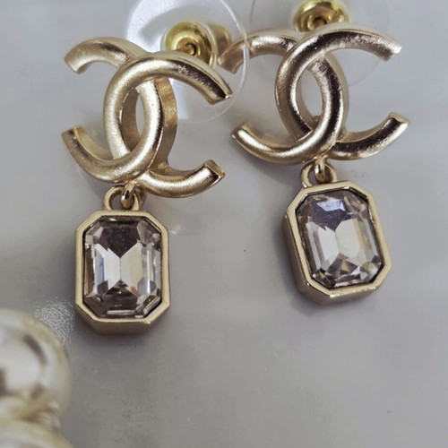 Chanel earrings with white and gold details