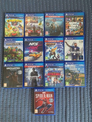 PS4 game bundle with 13 titles including Spider-Man and FIFA 23