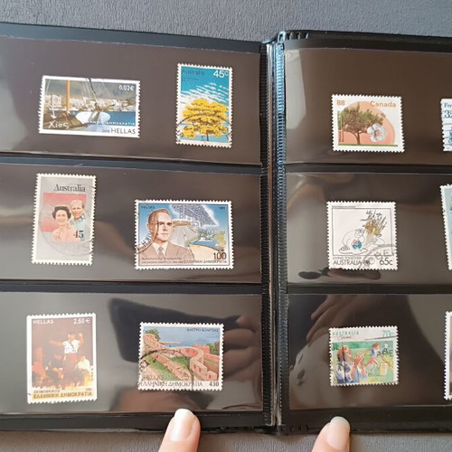 Stamp album with 120 stamps like new, Greece Australia Cyprus Germany America Canada
