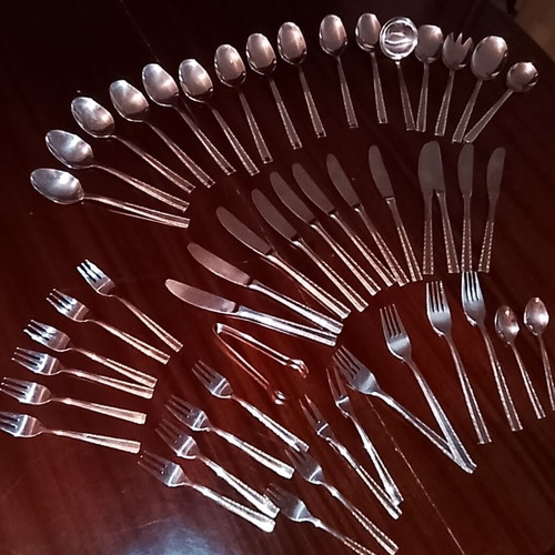 Solingen cutlery set incomplete with gold border on handles, used