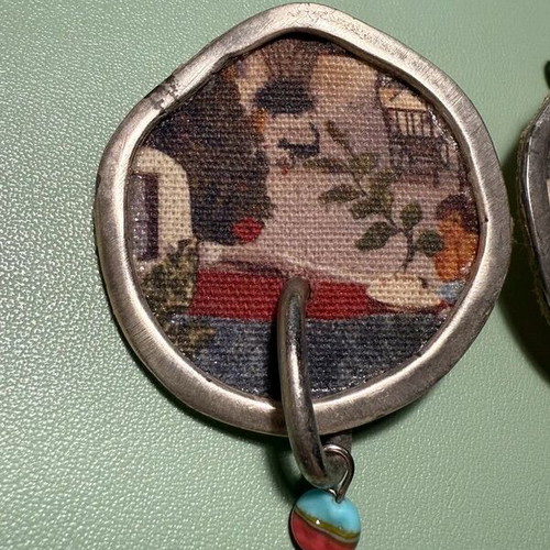 Handmade earrings used with canvas, metal and stones