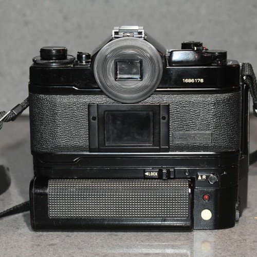 Canon A-1 collectible pack like new with Motor Drive, strap and 35mm f/2.8, 135mm lenses