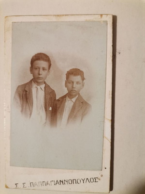 Old photograph used “Two Friends” by Papagiannopoulos on cardboard