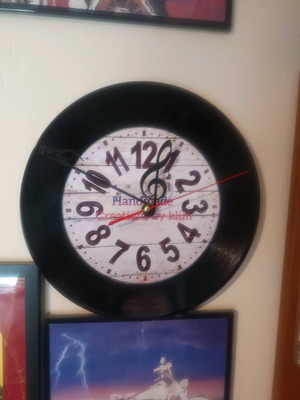 Wall clock used made from vinyl record with note hands handmade