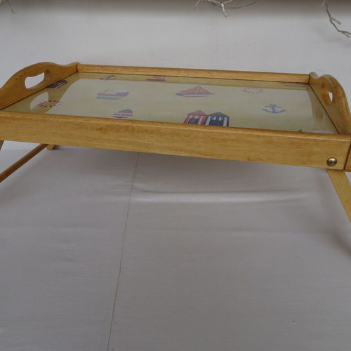 Vintage wooden breakfast tray with nautical theme used