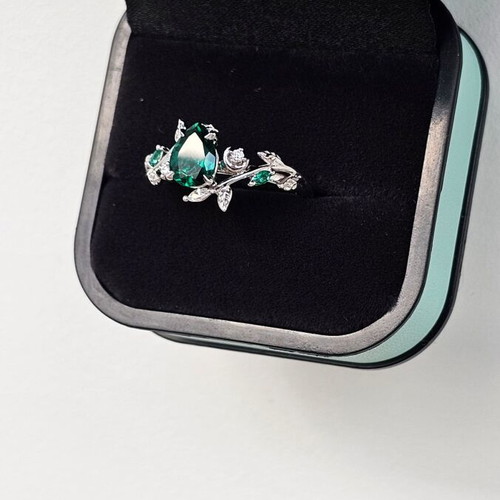 14K White Gold Engagement Ring with Emerald and Moissanite