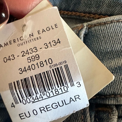American Eagle stretch jean with rips new size S