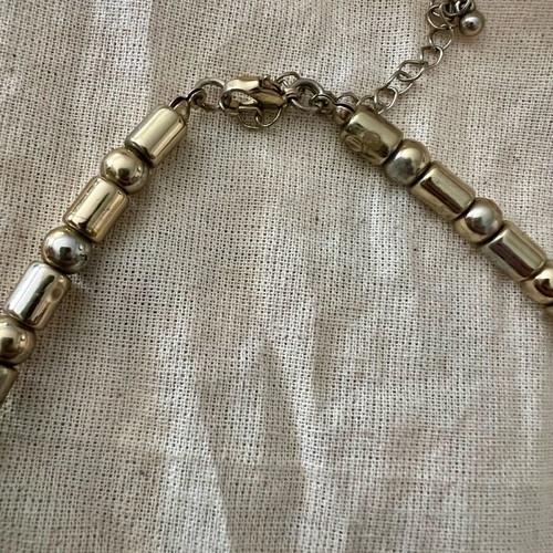 Statement necklace with large beads used, purple and gold details