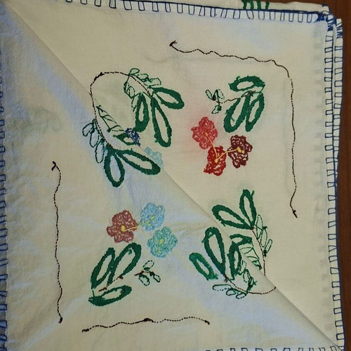 Vintage handmade embroidered tablecloth with flowers and needlework