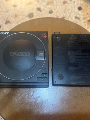 Sony Discman D-100 with battery pack used, missing play button