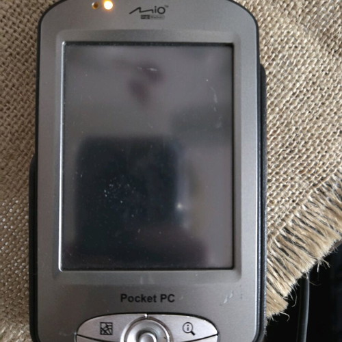 Pocket PC Navigator mio used with mounting base and charging cable