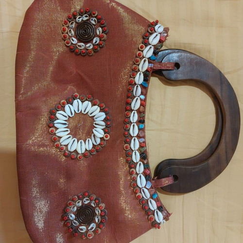 Handmade summer handbag in like new condition with shells and wooden handle orange