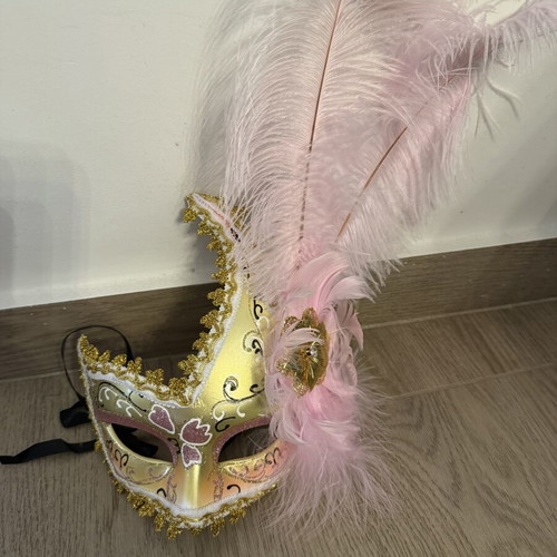 Venetian mask with pink feathers like new