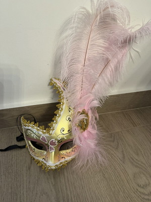 Venetian mask with pink feathers like new