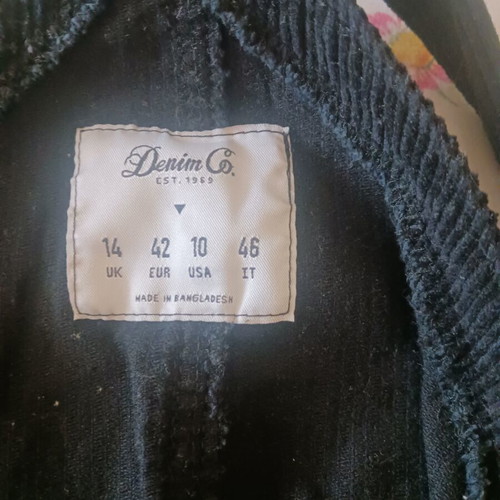 Black corduroy salopette with front and side pockets