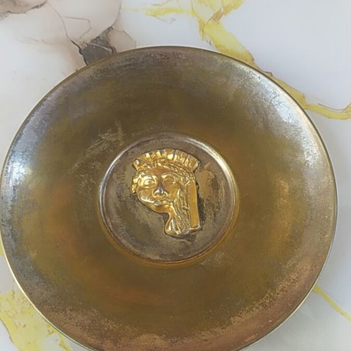 Decorative plate, possibly brass