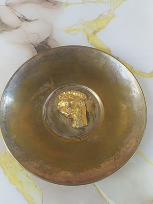 Decorative plate, possibly brass