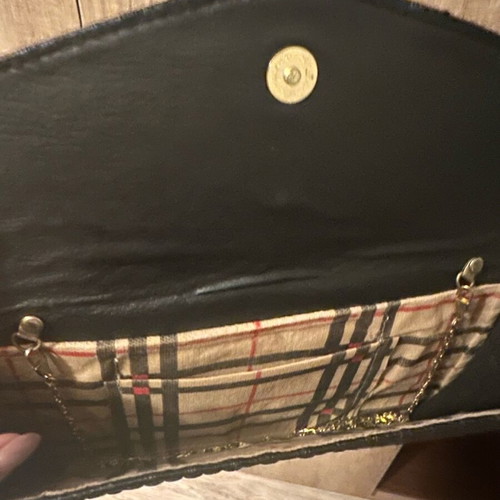 Black clutch bag with bow and gold chain like new