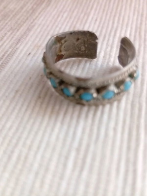 Ring with turquoise beads used, silver color