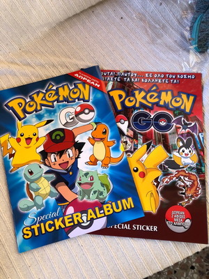 Pokémon 2016 Golden Shop and Giannakis Albums new, set of 2