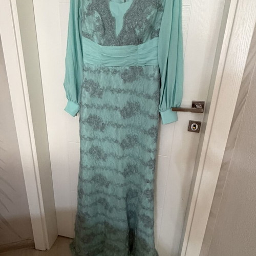 Long turquoise dress with lace embroidery and satin details
