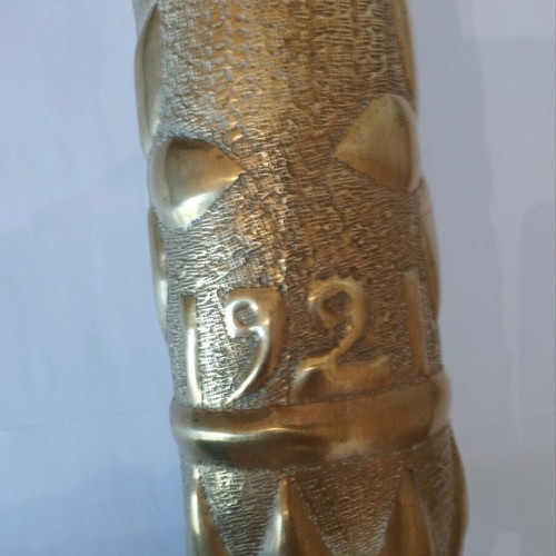 Bronze carved shell casing like new