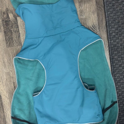 Waterproof dog jacket like new with fleece lining in petrol color