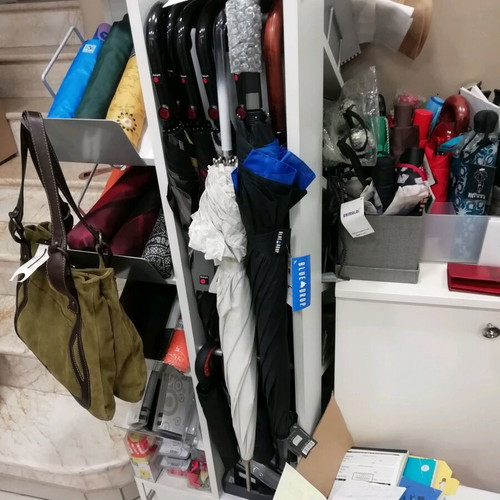 Professional umbrella stand like new, rotating for umbrellas
