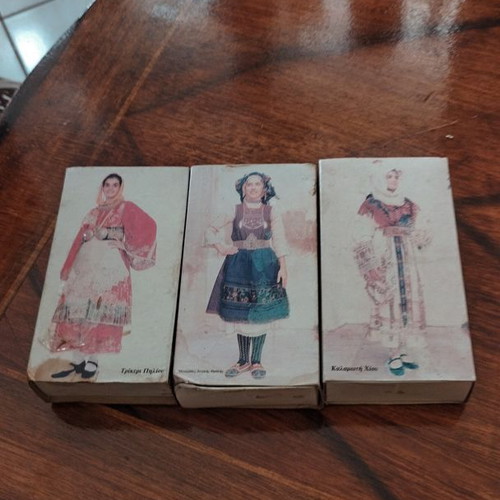 Vintage collectible matchboxes used with traditional Greek costumes