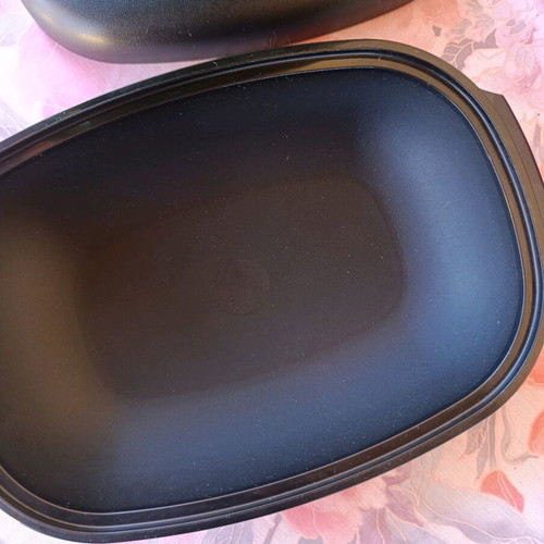 Oval Tupperware server with strainer new, black and green