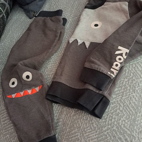 Kids' monster-themed grey tracksuit set used, sizes 2-3