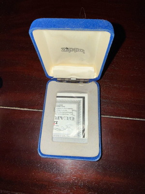 Zippo lighter used with decorative feather emblem in gift case