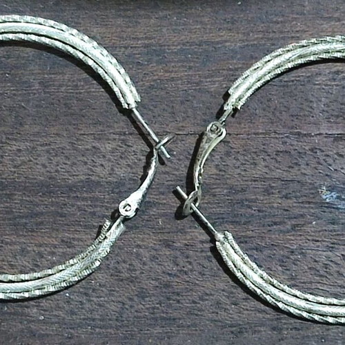 Metal earrings used, silver iron color