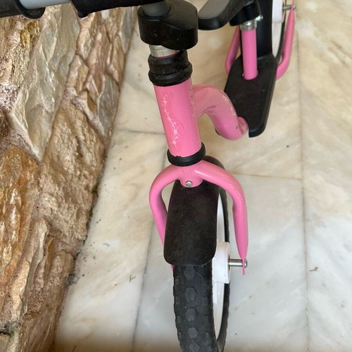 Balance bike pink like new with minor scratches on handlebar